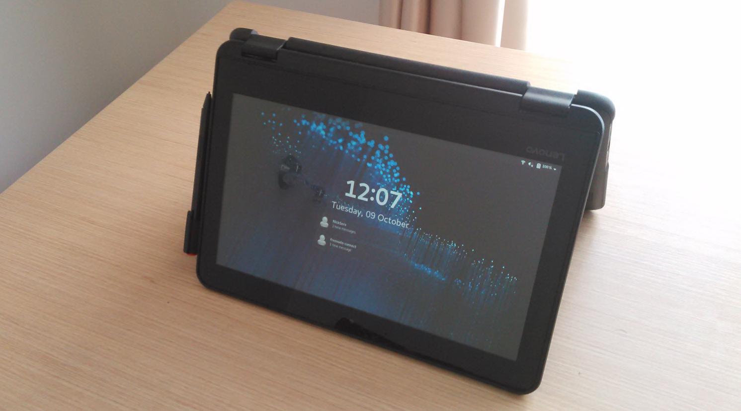 Lenovo 300e 81FY in the tent position, showing the GNOME lock screen